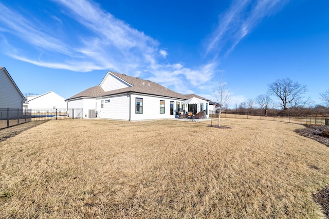 back of house featuring a yard and a patio area