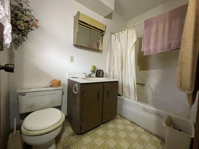 full bathroom featuring vanity, toilet, and shower / tub combo