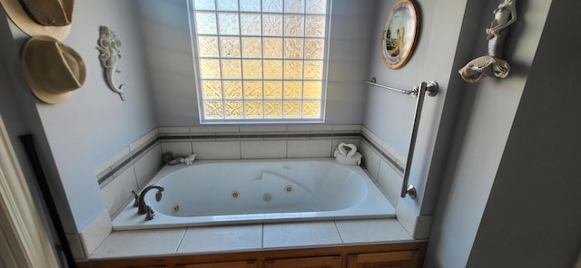 bathroom featuring tiled tub