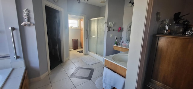 bathroom featuring walk in shower, tile patterned floors, and vanity