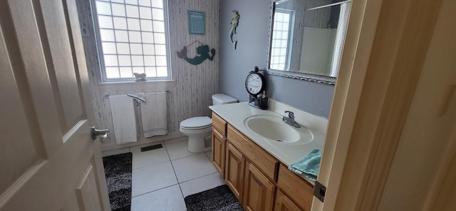 bathroom with vanity, tile patterned floors, and toilet