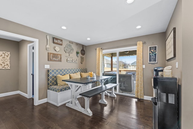 dining room with breakfast area and dark wood-type flooring