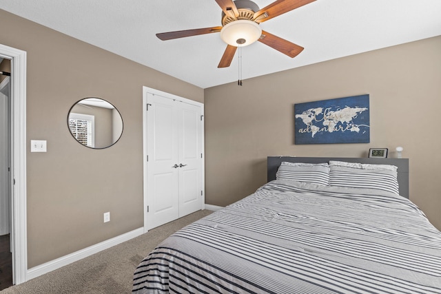 bedroom with carpet floors, ceiling fan, and a closet