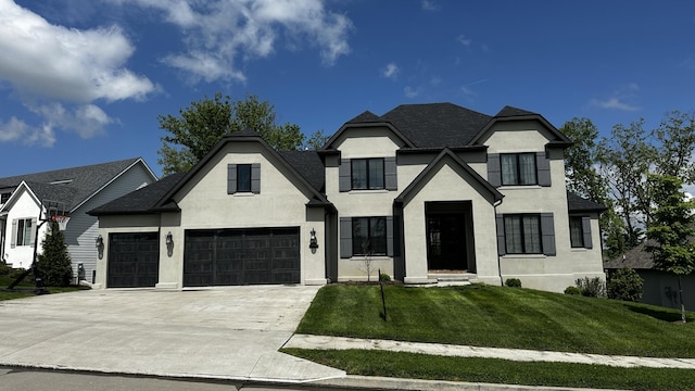 7333 Sella Ct, Columbia, MO 65203 - french country style house featuring stucco siding, a front lawn, concrete driveway, and an attached garage