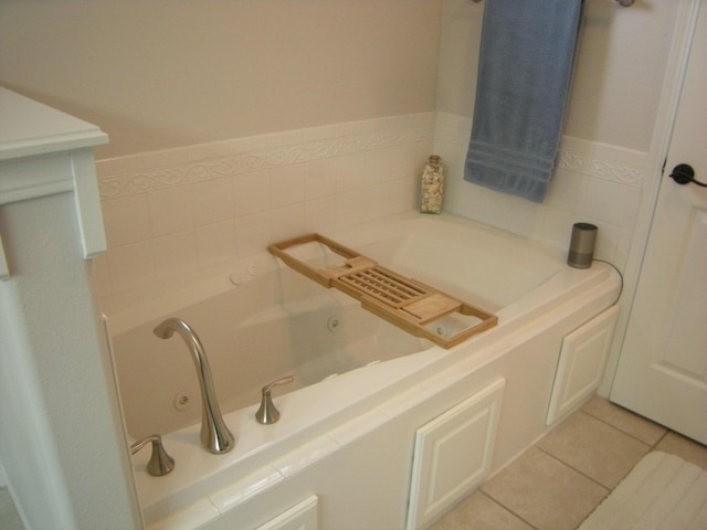 bathroom featuring tile patterned floors and a bathing tub