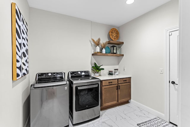 laundry area featuring cabinets and independent washer and dryer