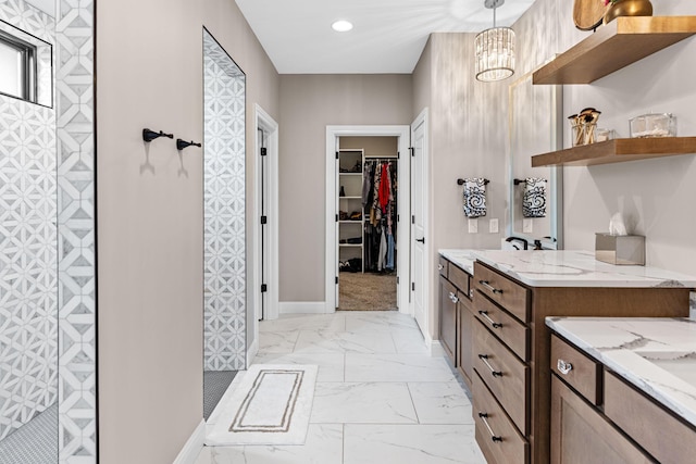 bathroom featuring walk in shower and vanity