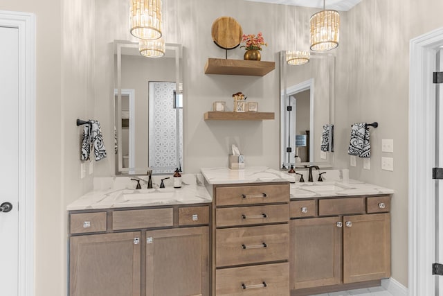 bathroom featuring vanity and an inviting chandelier