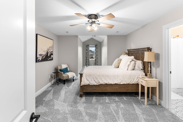 carpeted bedroom with vaulted ceiling and ceiling fan