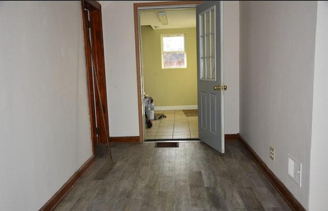 hallway with dark hardwood / wood-style floors