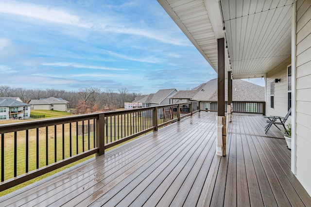 wooden deck with a yard