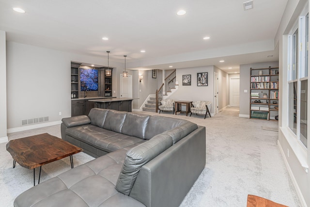 living room featuring light carpet