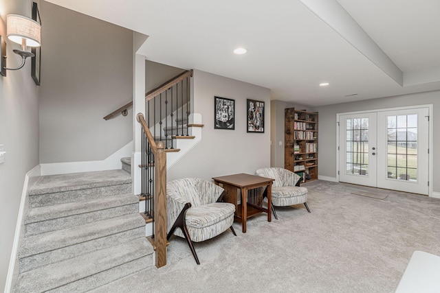 staircase with carpet floors and french doors