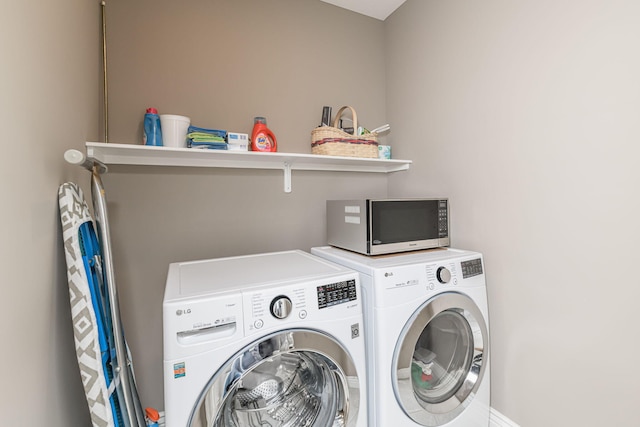 washroom with washer and clothes dryer