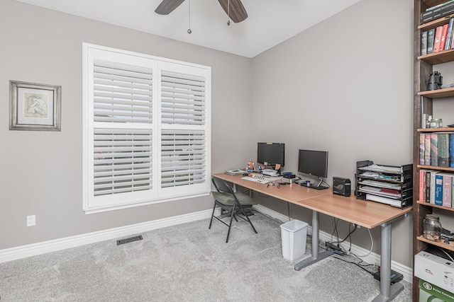 carpeted office space with ceiling fan and washer / clothes dryer