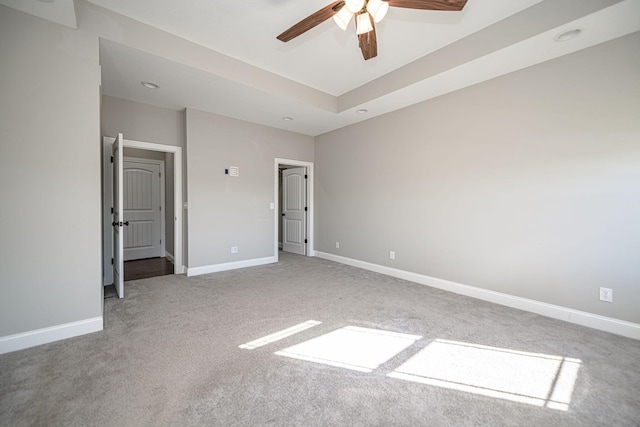 unfurnished bedroom with ceiling fan and carpet