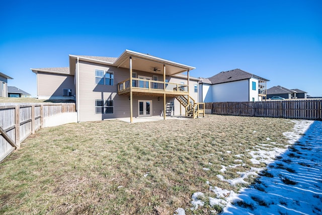 rear view of property with a yard, ceiling fan, and a patio area