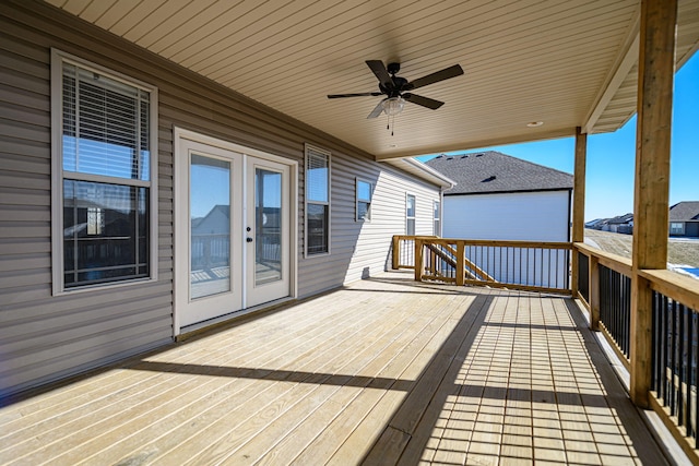 deck with french doors and ceiling fan