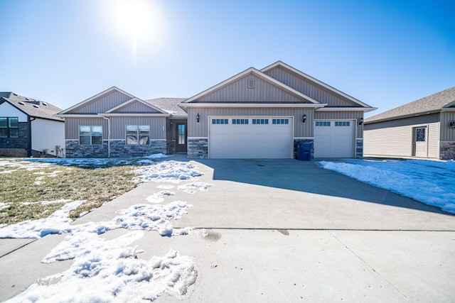 5580 Charlotte Dr, Ashland, MO 65010 - craftsman-style house featuring an attached garage, stone siding, board and batten siding, and concrete driveway