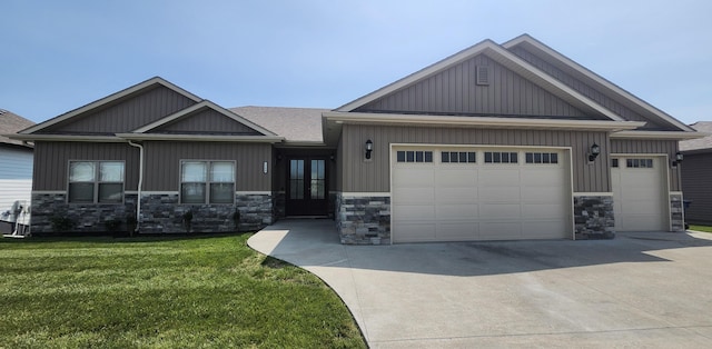 5580 Charlotte Dr, Ashland, MO 65010 - craftsman house with stone siding, a garage, french doors, and concrete driveway