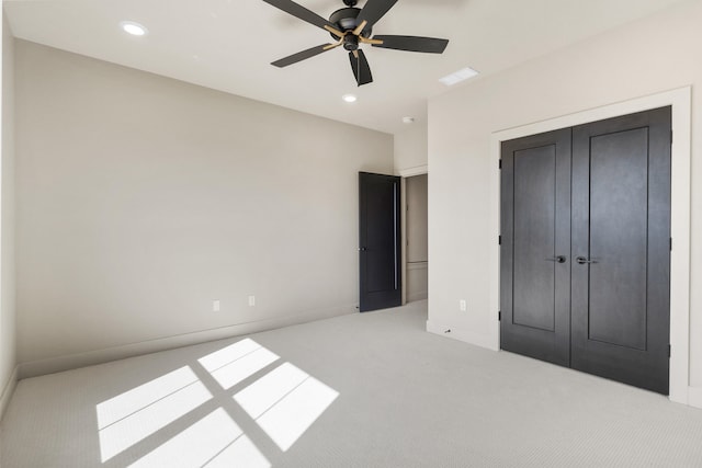 unfurnished bedroom featuring visible vents, recessed lighting, a closet, carpet floors, and baseboards