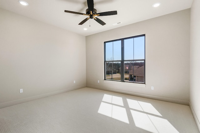 carpeted empty room with recessed lighting, visible vents, and baseboards