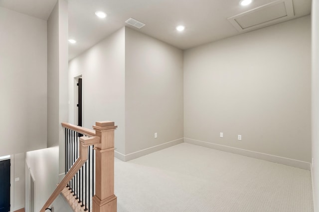 hallway with recessed lighting, visible vents, an upstairs landing, and carpet