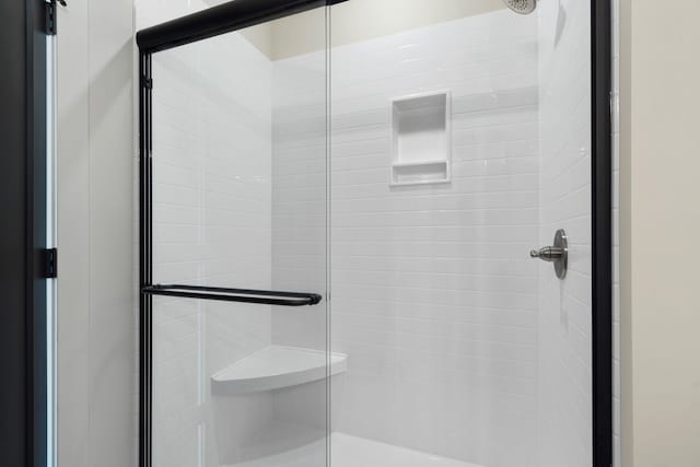 full bath with a shower stall