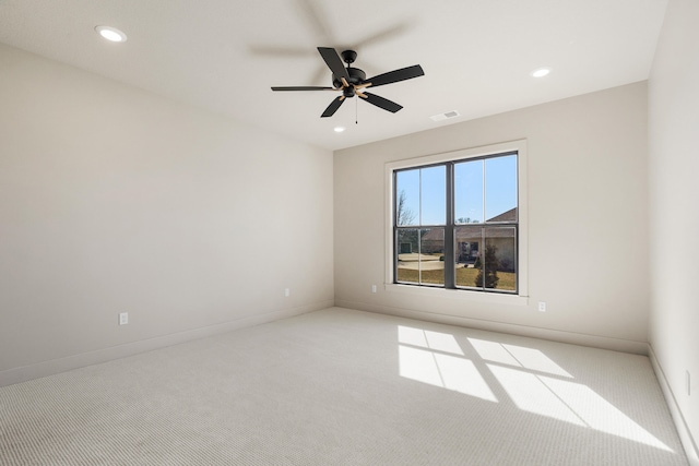 spare room featuring a ceiling fan, recessed lighting, carpet, and visible vents