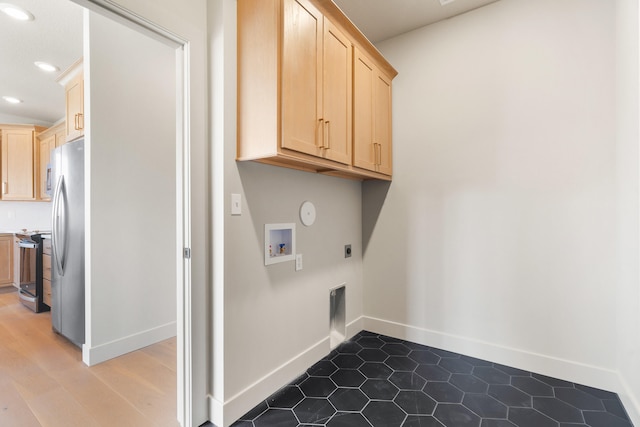 clothes washing area featuring baseboards, hookup for an electric dryer, cabinet space, recessed lighting, and washer hookup