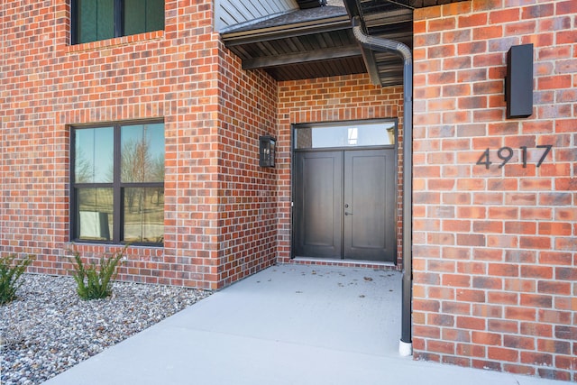 property entrance with brick siding