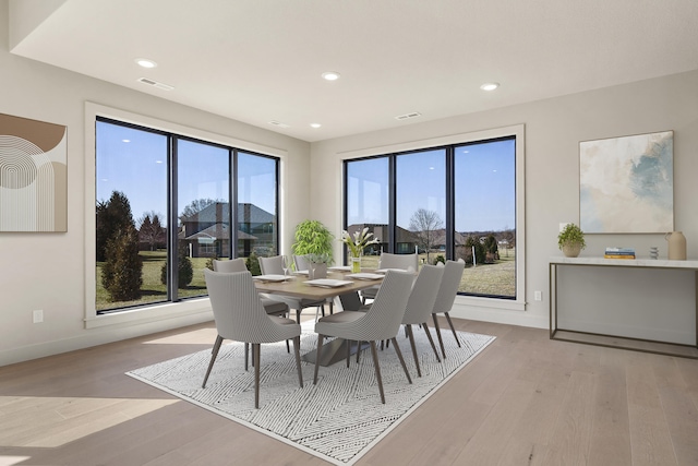 dining room with recessed lighting, visible vents, and light wood-style flooring