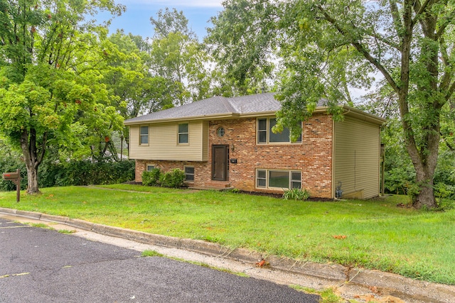 split foyer home with a front lawn