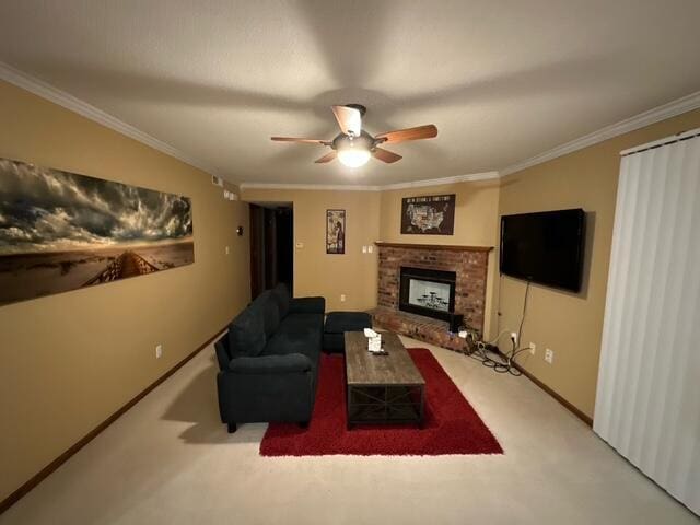 living area with carpet floors, a ceiling fan, baseboards, a brick fireplace, and crown molding