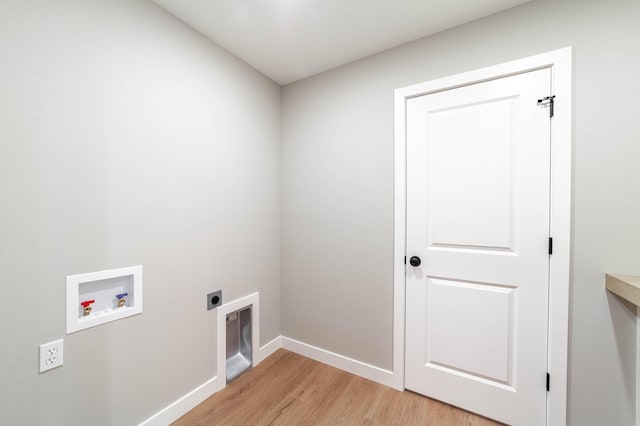 washroom with electric dryer hookup, washer hookup, and light wood-type flooring