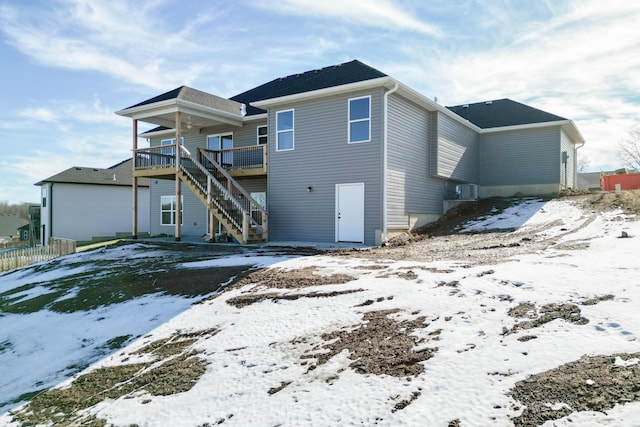 snow covered property featuring a deck