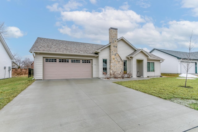 view of front of property featuring a garage and a front yard