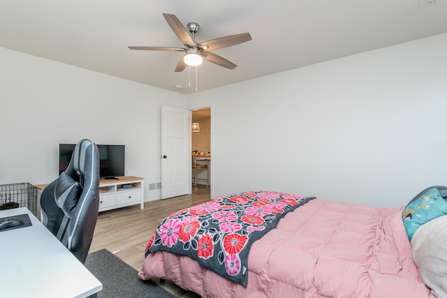 bedroom with ceiling fan and light wood-type flooring