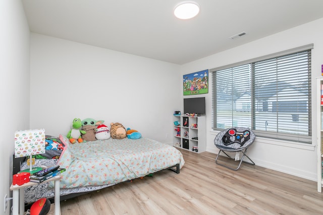 bedroom featuring wood-type flooring