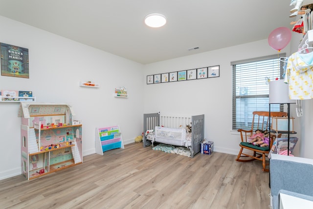 bedroom with light wood-type flooring