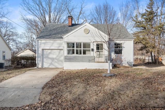 view of front of property with central AC and a garage