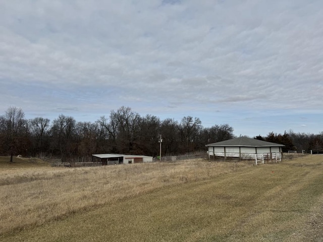 view of yard with a rural view