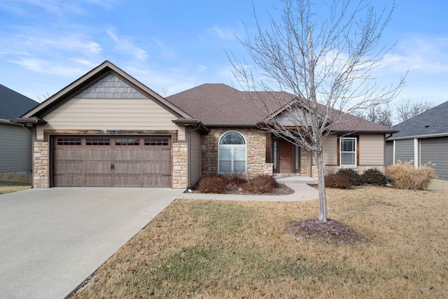 view of front facade with a garage and a front lawn