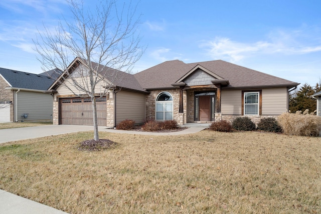 view of front facade with a garage and a front yard