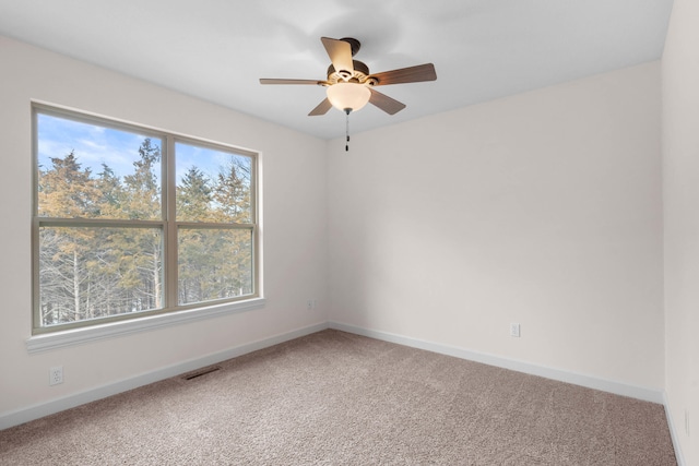 carpeted empty room with ceiling fan