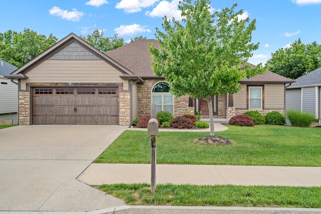 809 Rutland Dr, Columbia, MO 65203 - view of front of house with stone siding, an attached garage, concrete driveway, a front yard, and roof with shingles