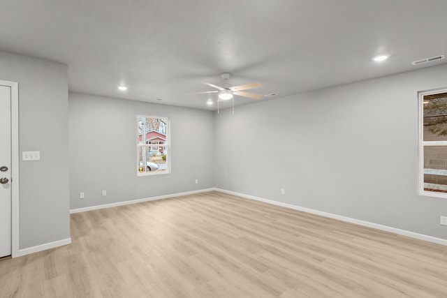 empty room featuring light hardwood / wood-style floors and ceiling fan