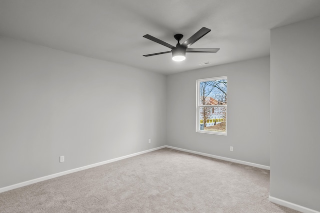 unfurnished room with light carpet and ceiling fan