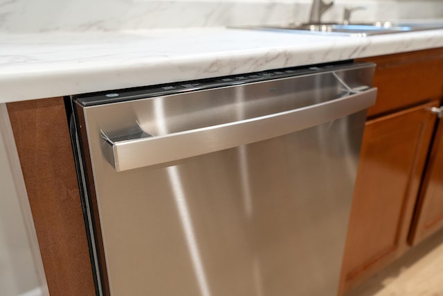 interior details featuring dishwasher and sink