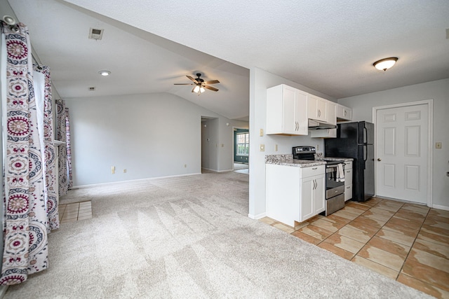 kitchen featuring stainless steel electric stove, white cabinetry, lofted ceiling, light colored carpet, and ceiling fan